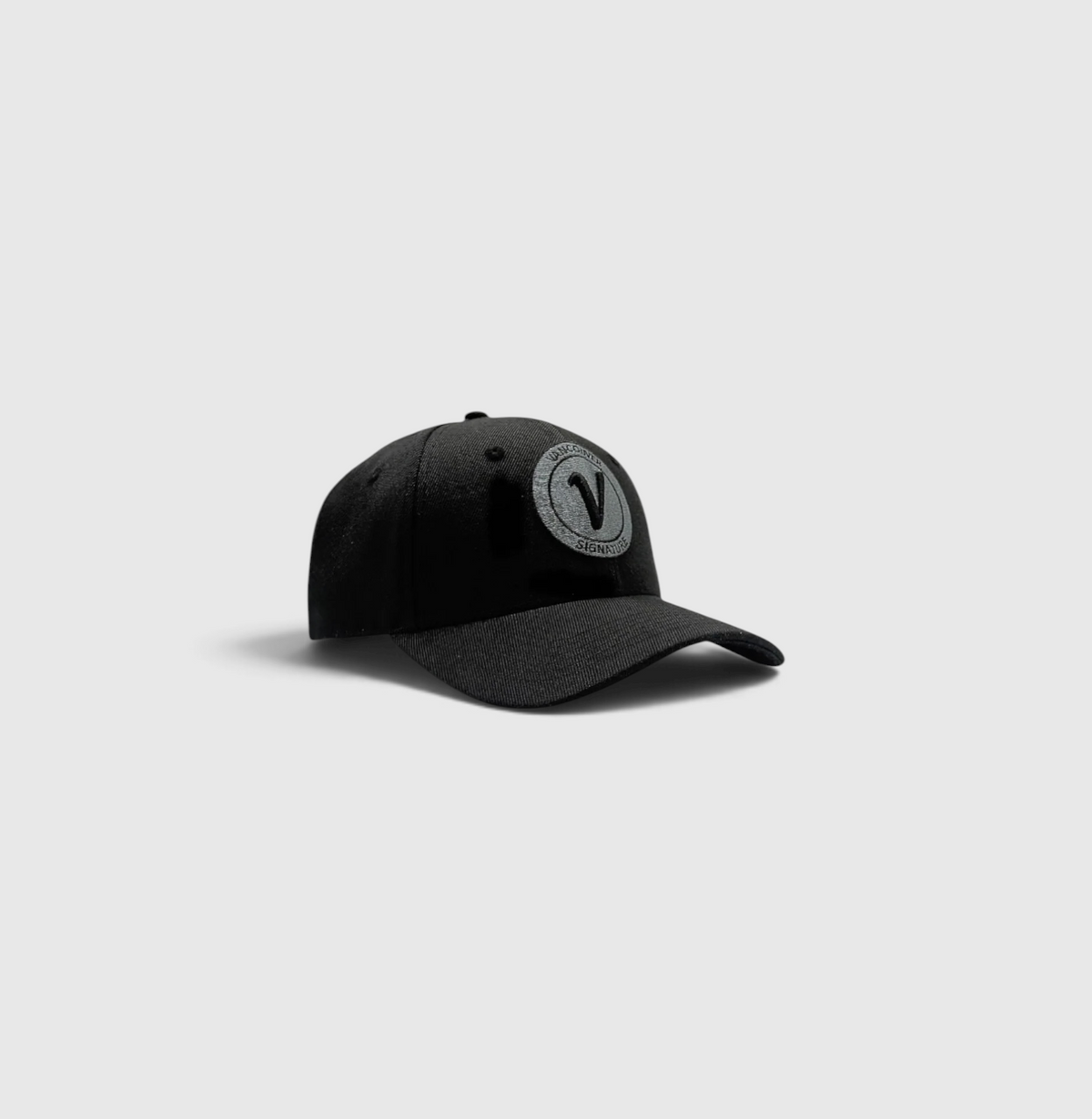 front view of the black on black First Up athleisure adjustable hat by Vancouver Signature