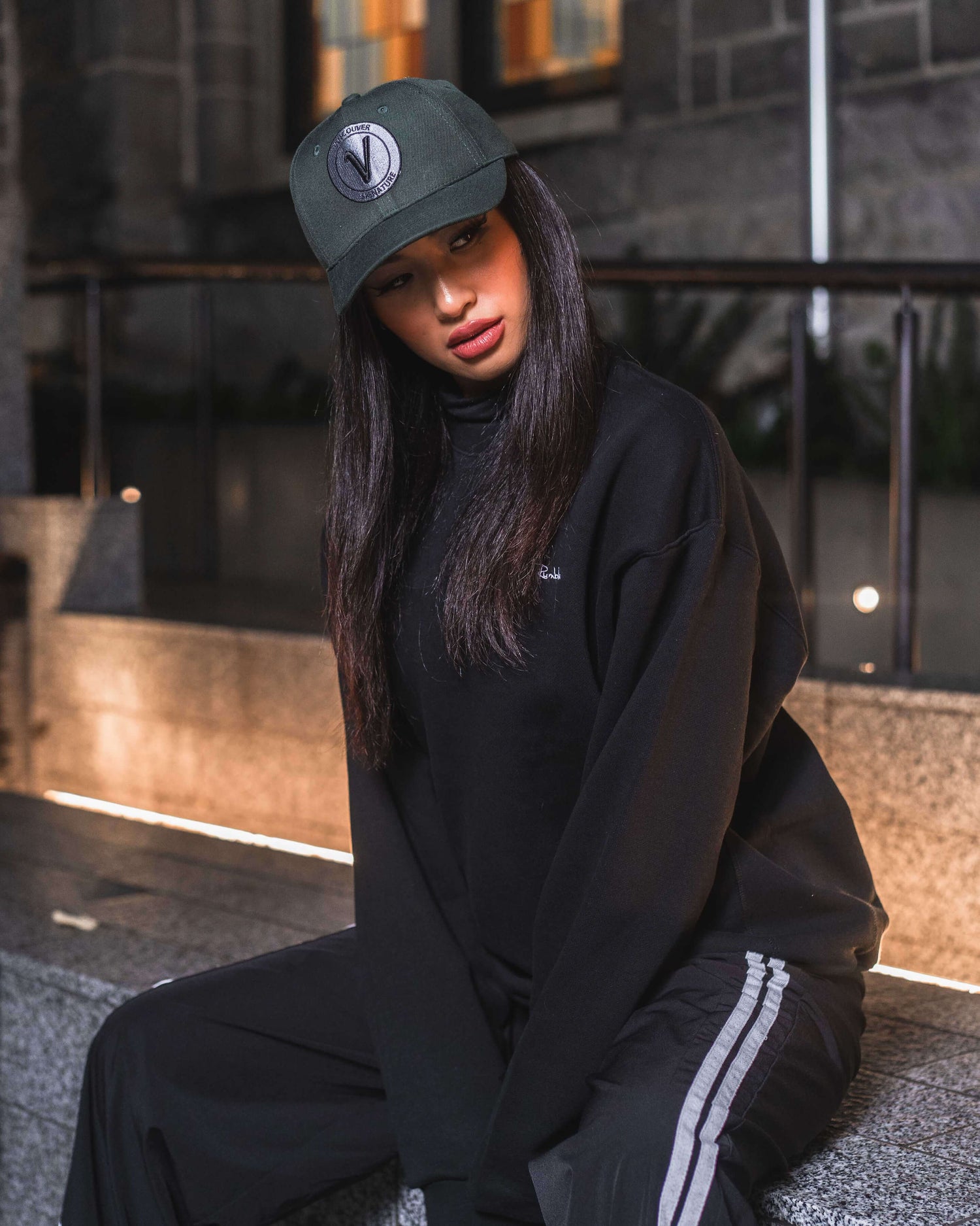 Woman wearing Vancouver Signature Listo structured hat at night