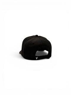 Rear view of the black and white First-Up lifestyle adjustable hat showing the adjustable back