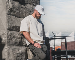 Male model wearing the white and white First-Up lifestyle hat outdoors in Vancouver