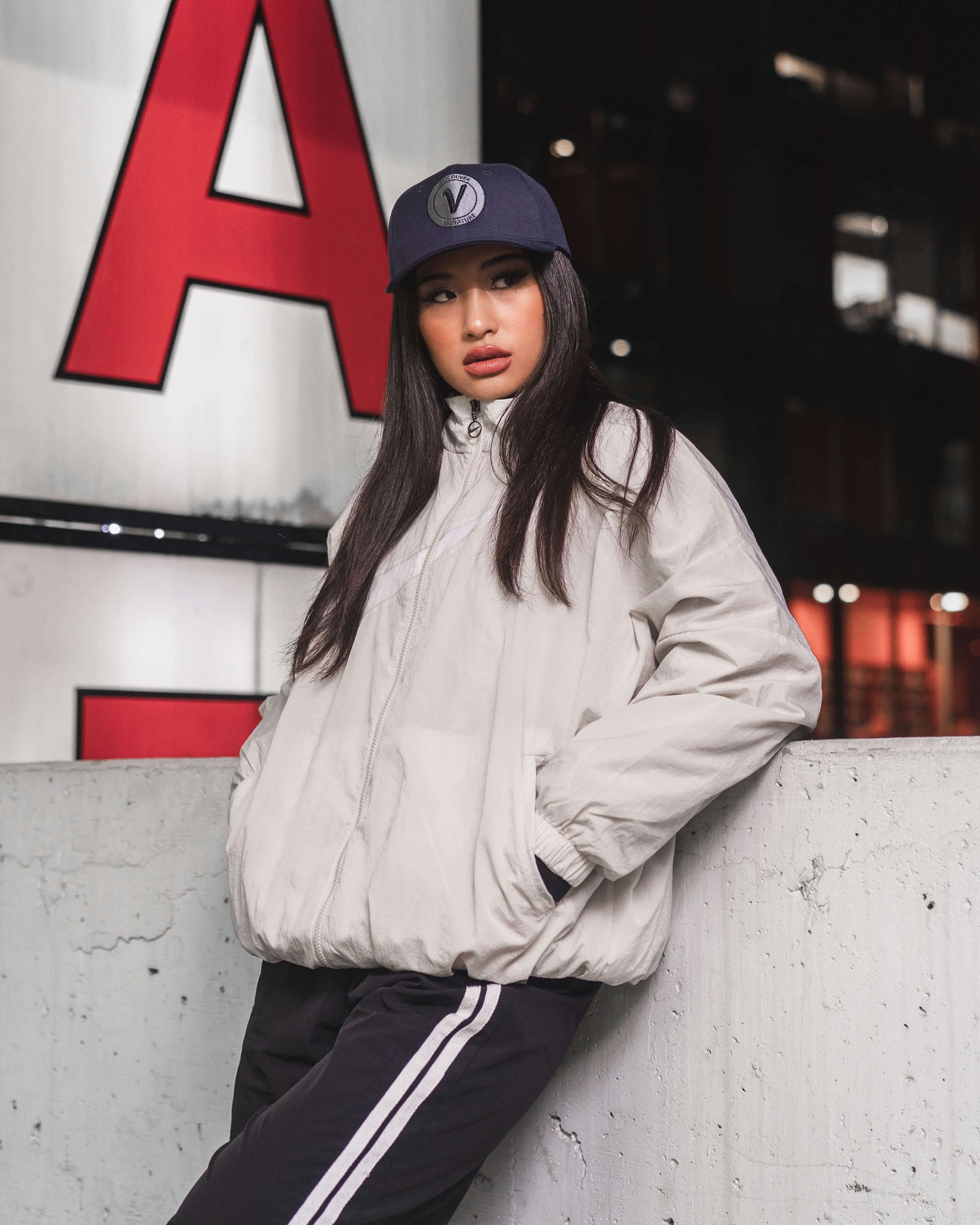 Model wearing FIRST UP athleisure hat by Vancouver Signature